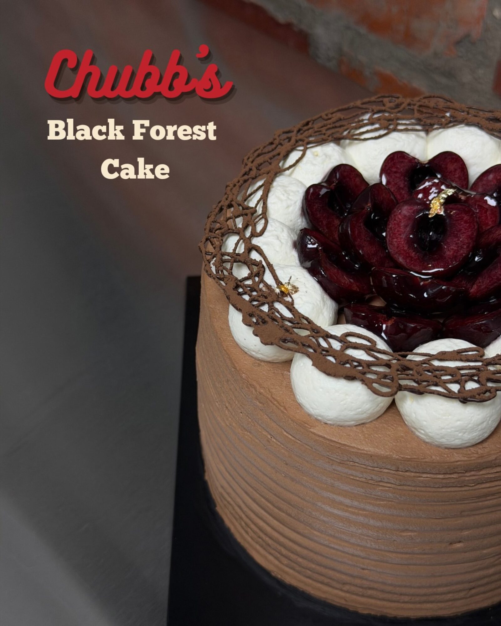 Black Forest Cake crowned with cherries and a chocolate lattice