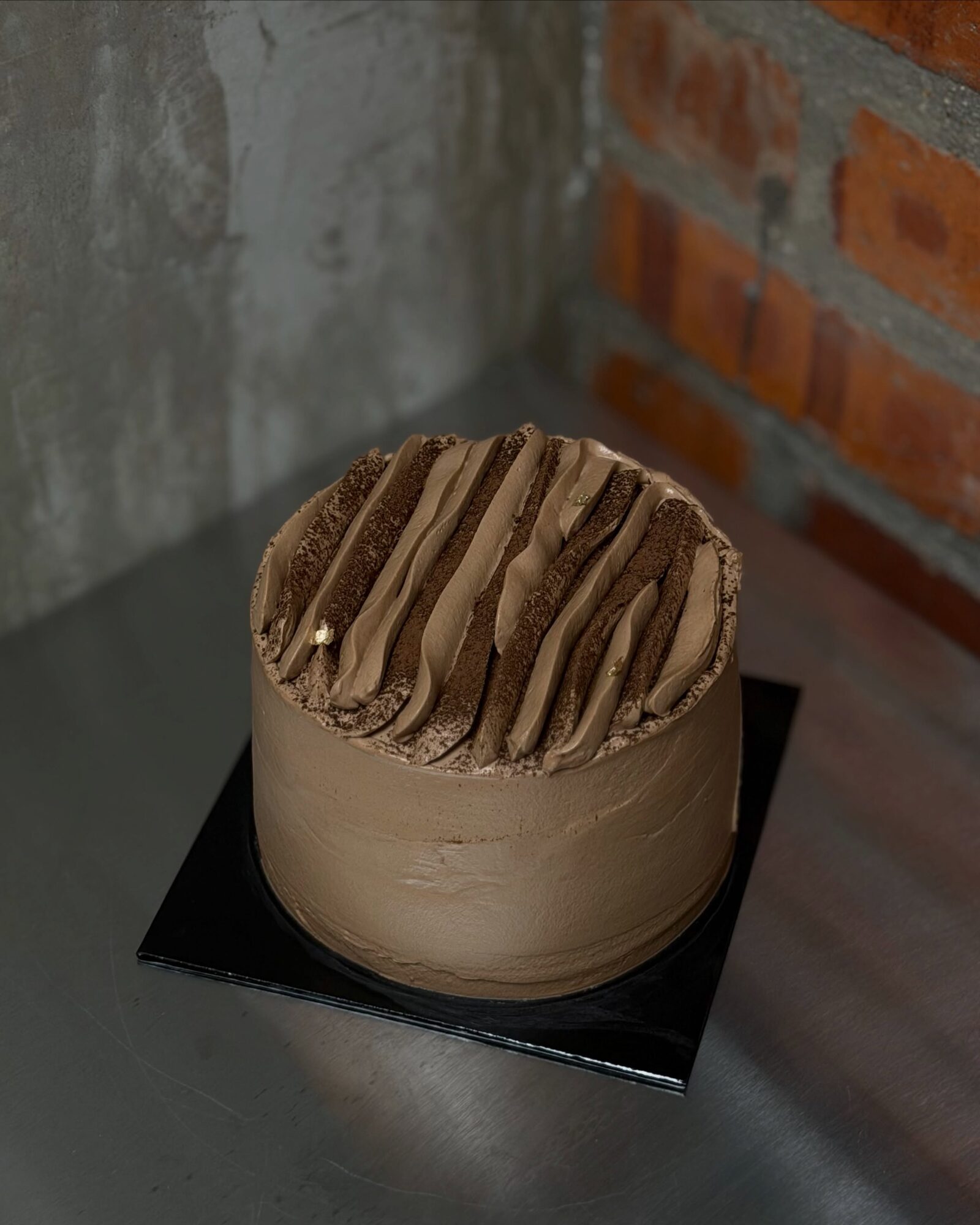 Dark Chocolate Cake on a black cake board