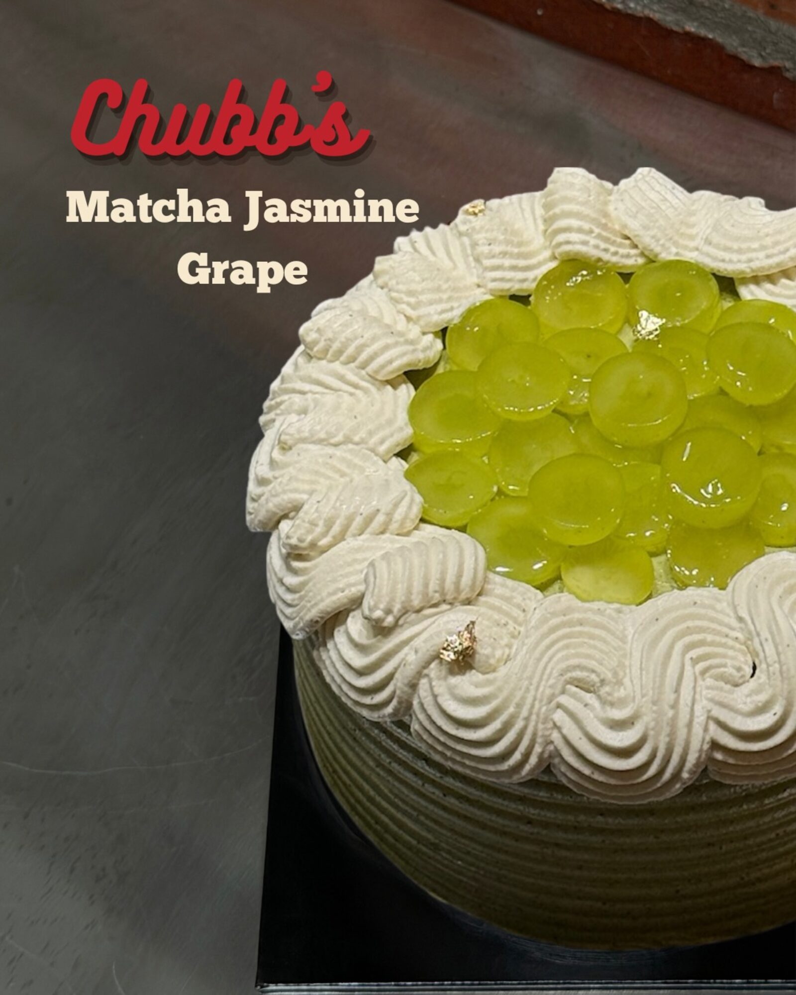 Matcha Jasmine Grape Cake topped with glazed green grapes