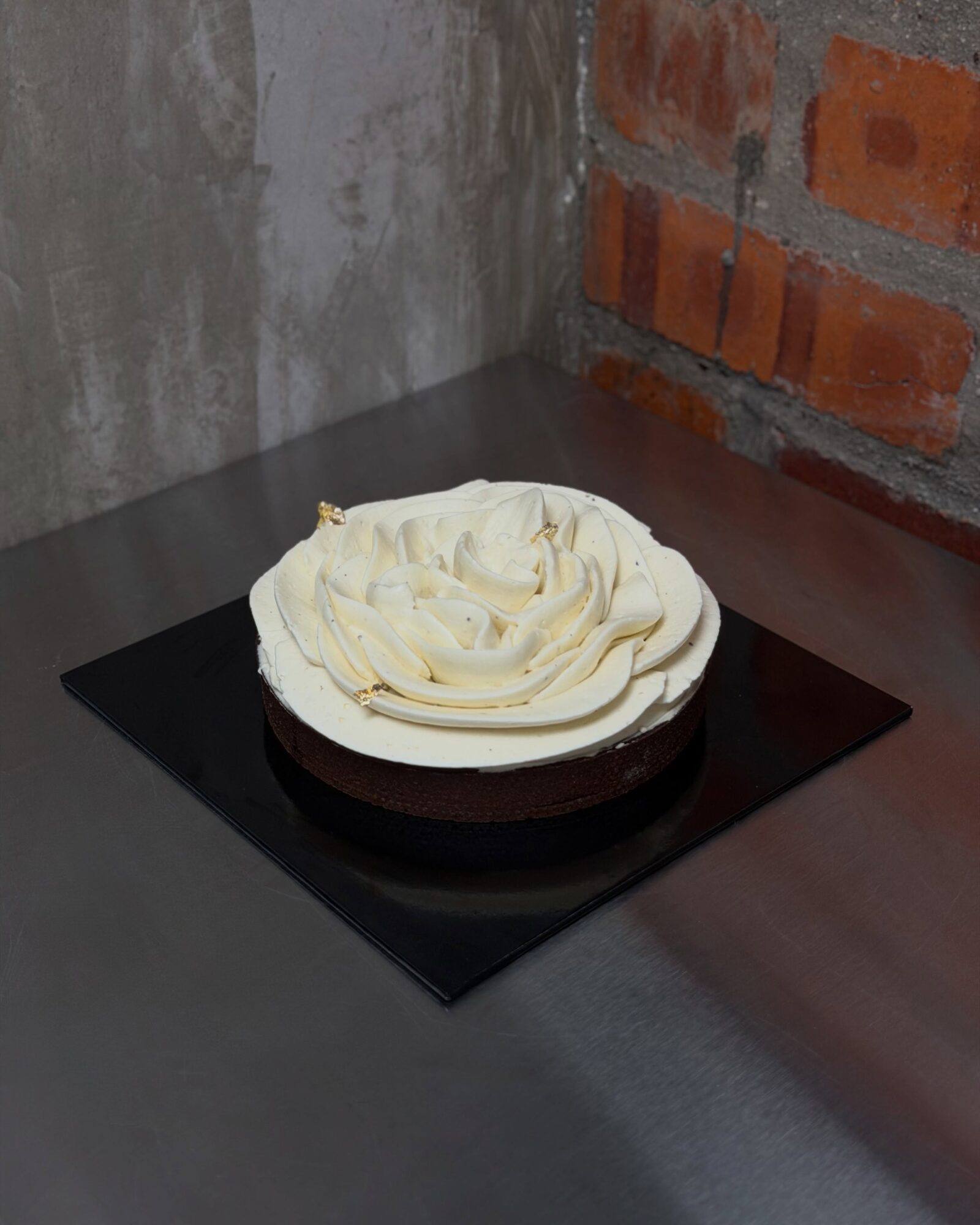 Tiramisu Tart on a black cake board